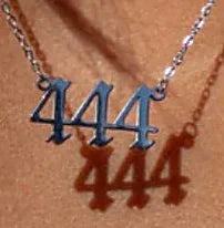 Close view of the numbered pendant and its lobster clasp