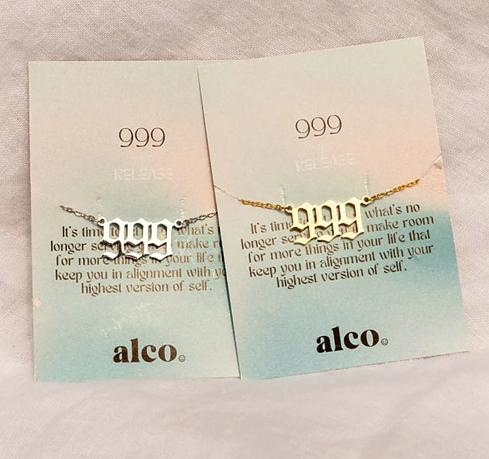 The pendant shown with the card explaining the number's meaning