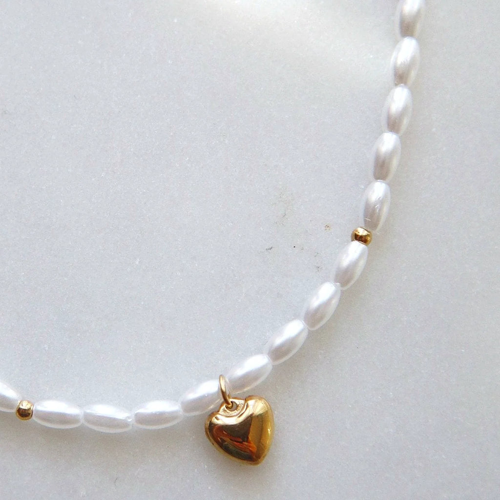 Pearl strand and gold-plated hardware shown together