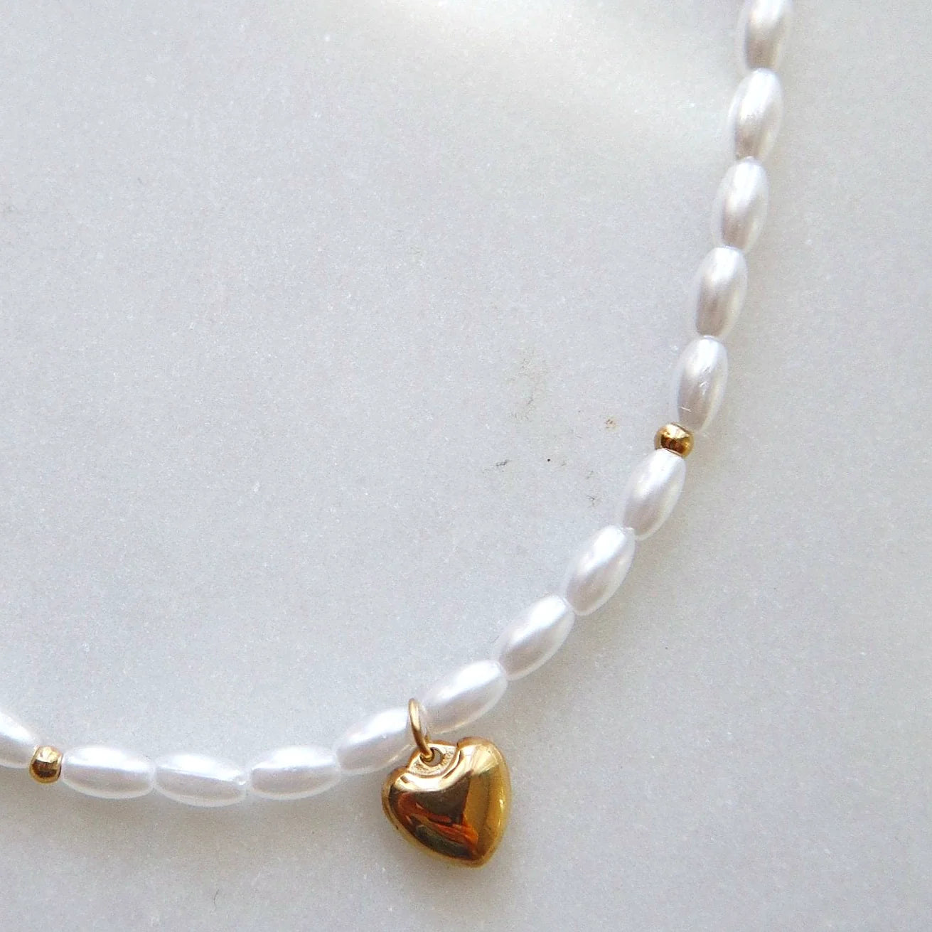 Pearl strand and gold-plated hardware shown together