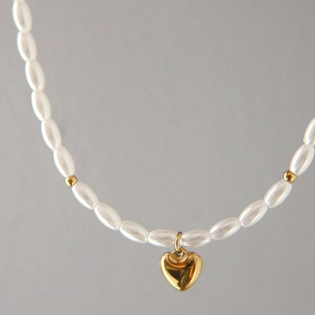 The choker laid flat, showing its extender chain