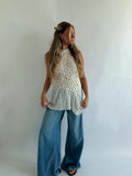 Lace top with a high neckline and gathering drawn in at the waist