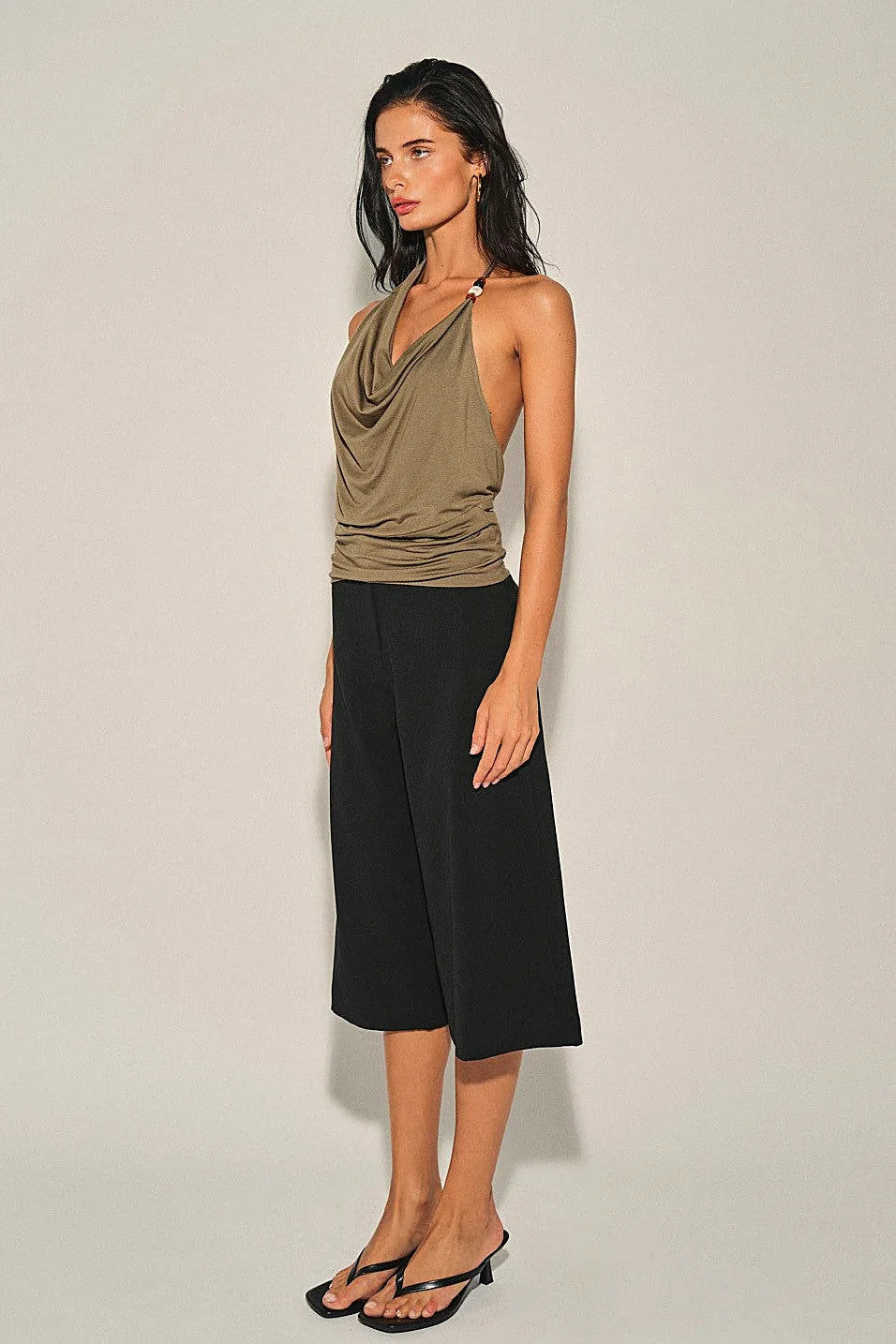 The draped front neckline of the olive halter top
