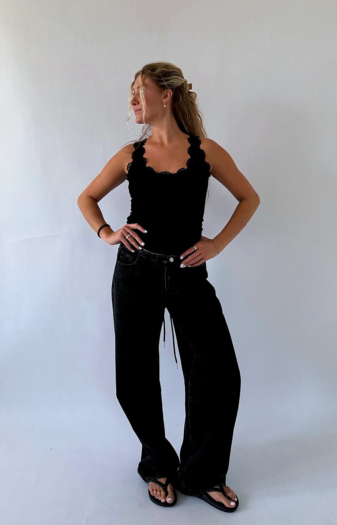 Black tank top edged with a fine band of lace