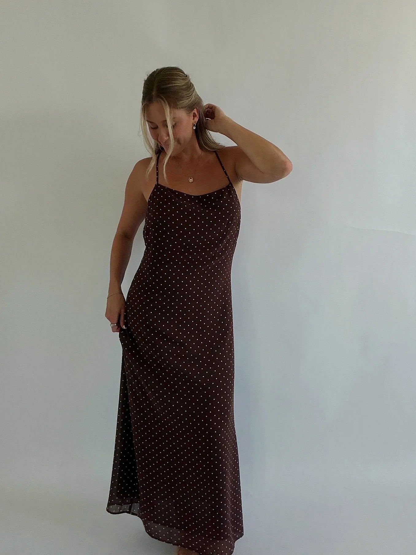 Back view showing the low back of the midi dress