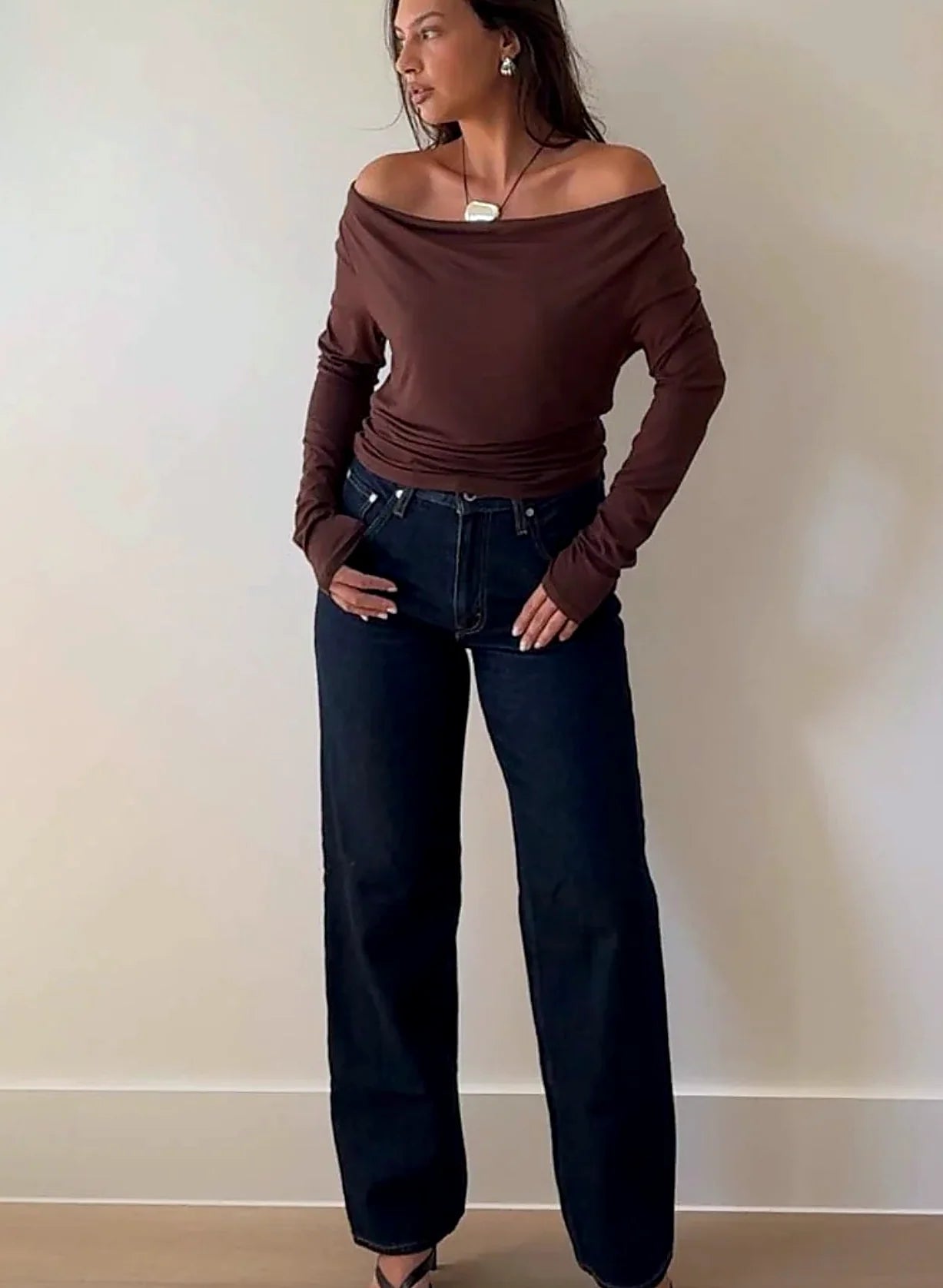 Close view of the cowl neckline gathering at the throat