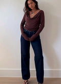 Long sleeve top with fabric draping in folds at the cowl neck