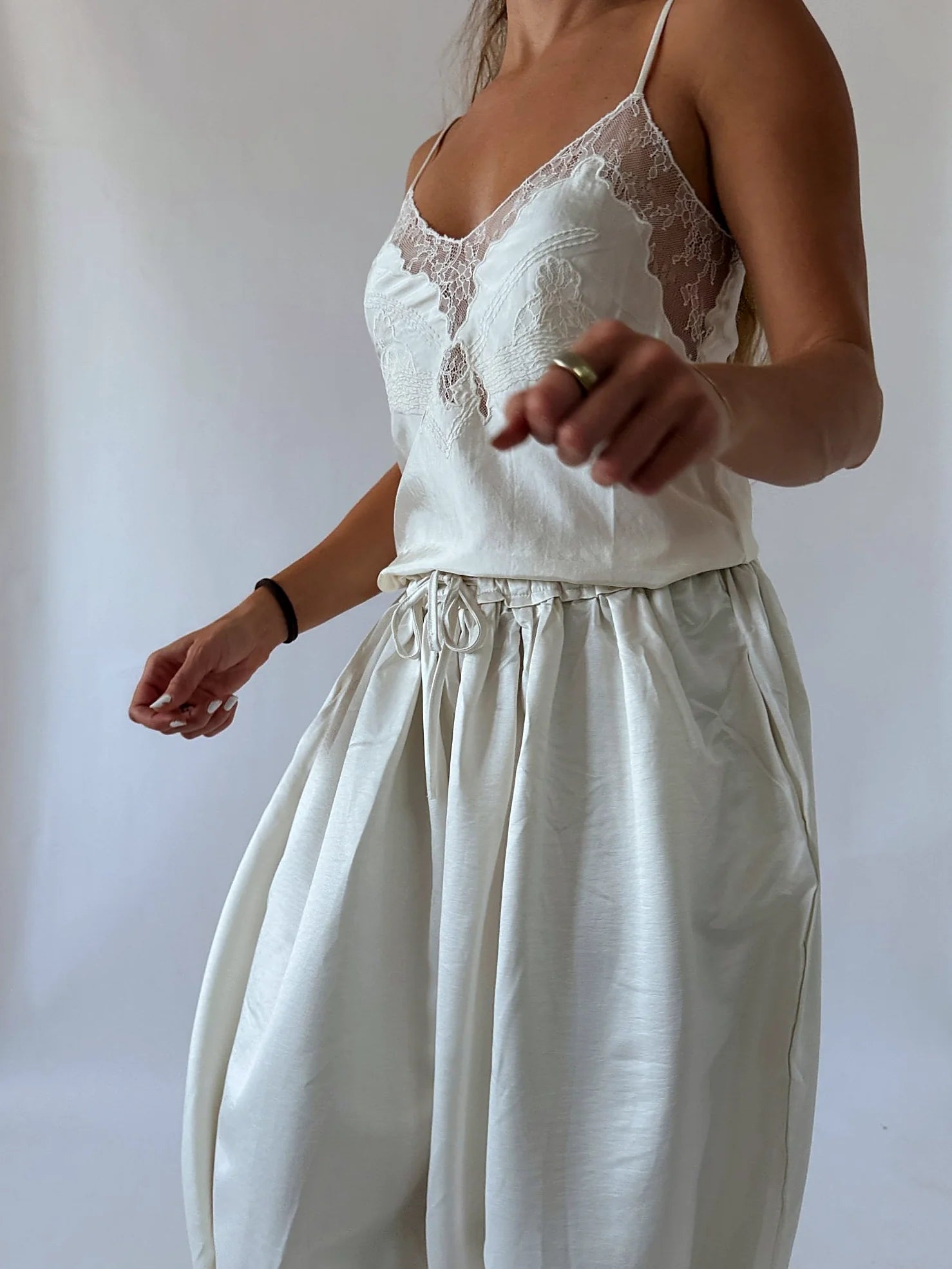Close view of the lace worked into the satin fabric