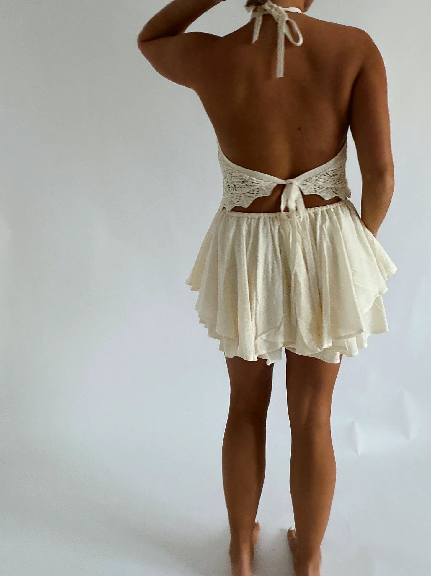 The halter neckline of the crochet top