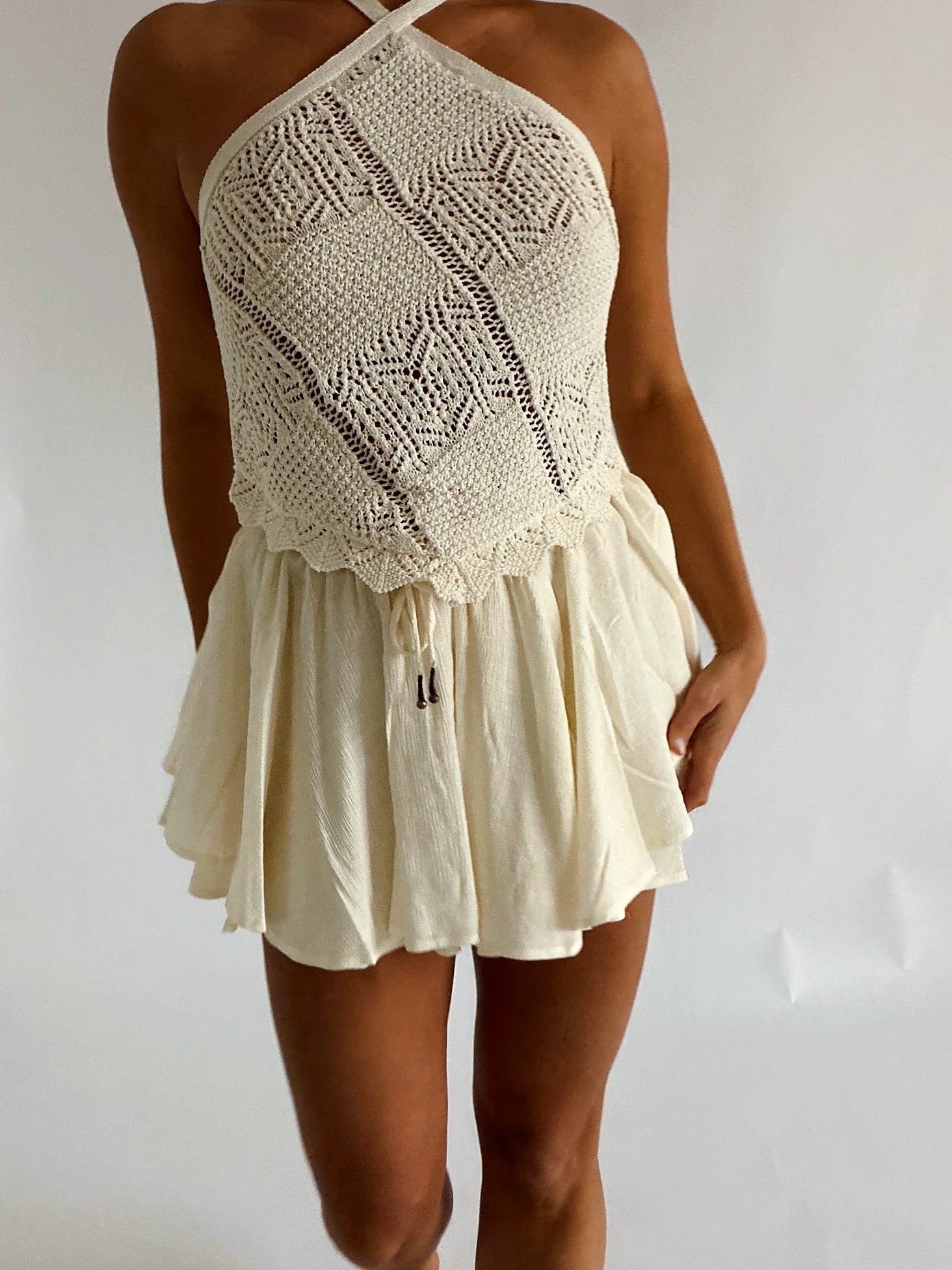 Sleeveless crochet halter top with a scalloped edge