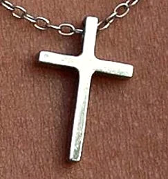 Close view of the minimalist cross pendant