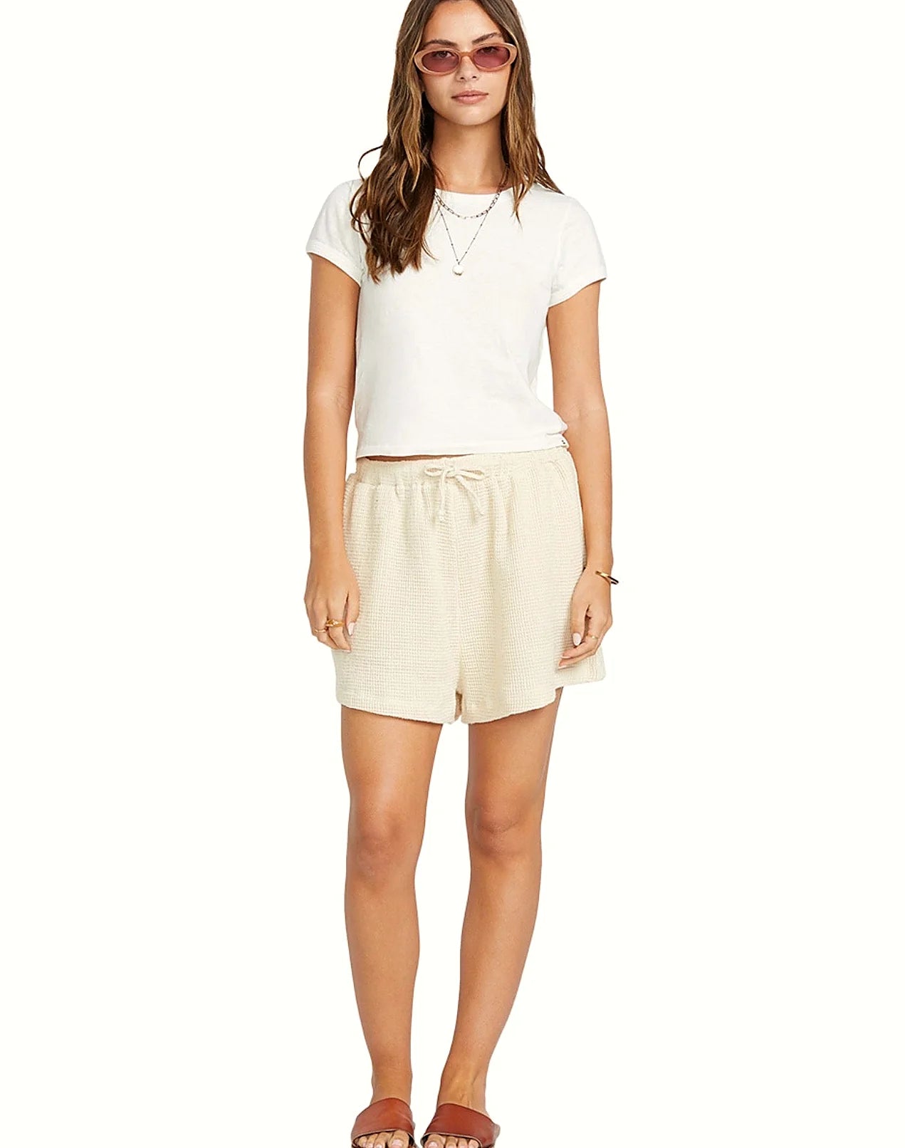 The neckline and shoulder seam of the white tee
