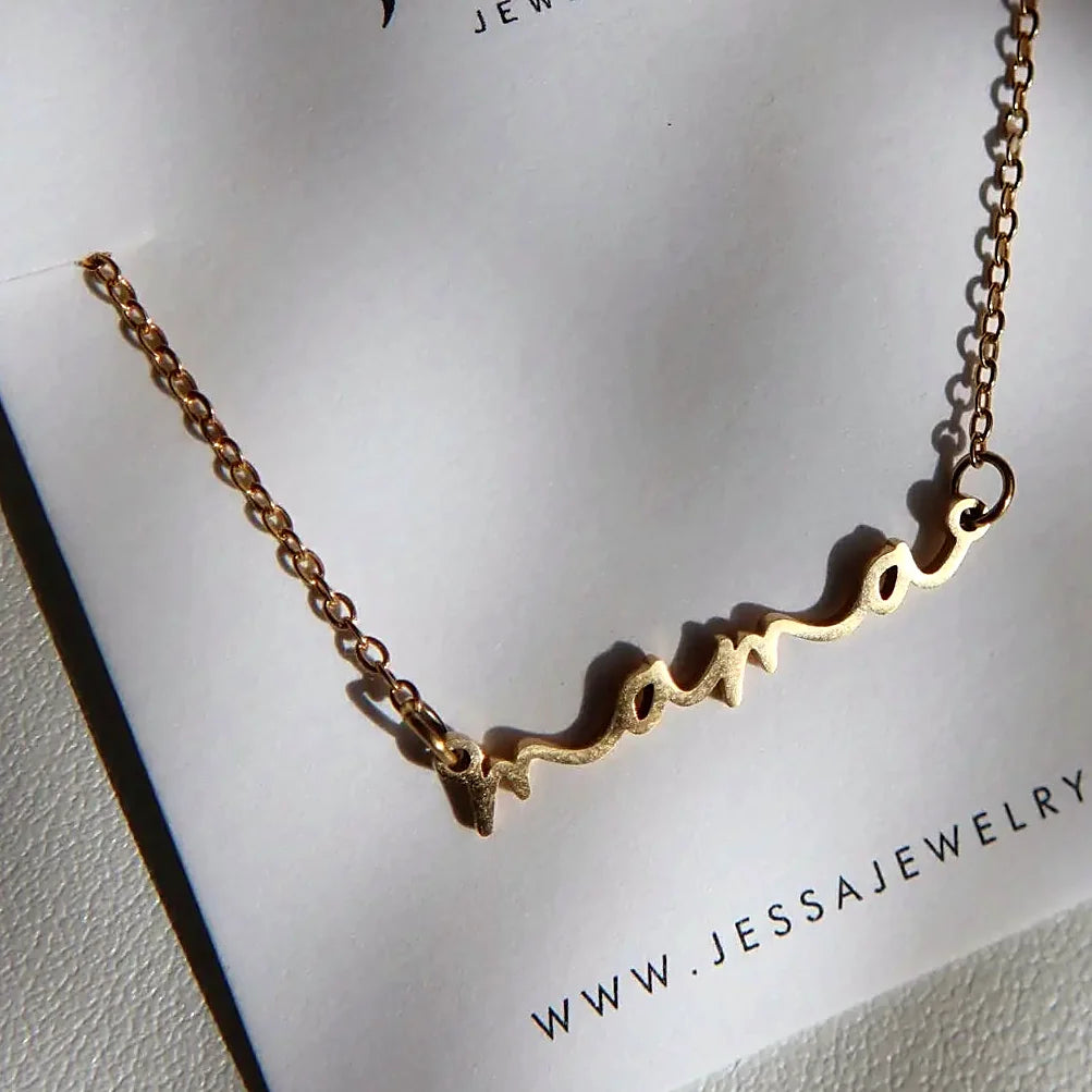 The necklace laid flat, showing chain and extender