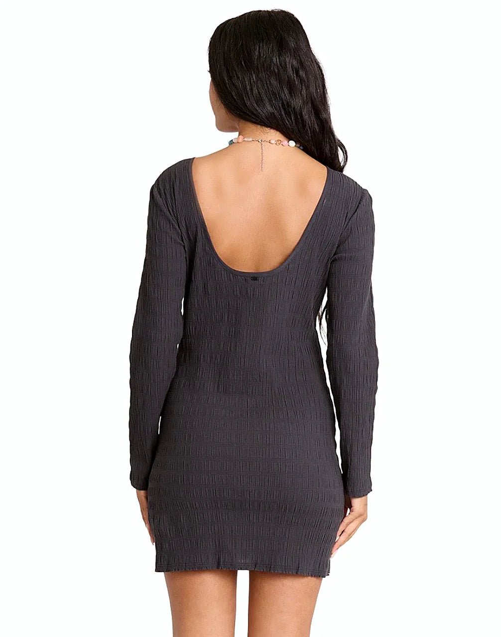 Back view showing the low back of the mini dress