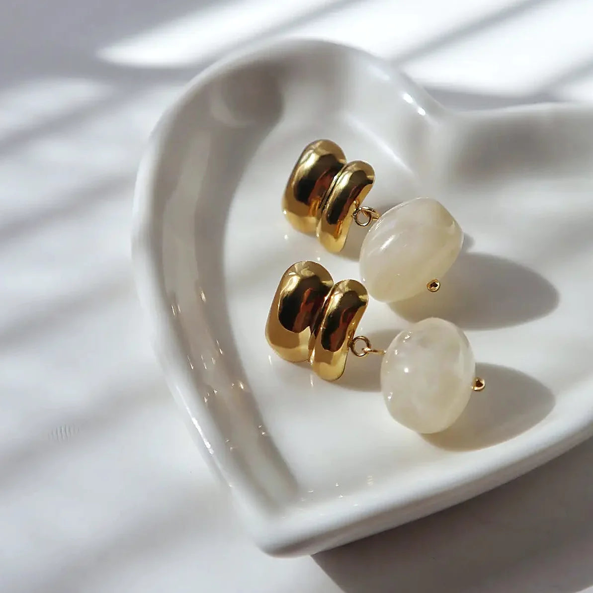 The stud fitting of the drop earring