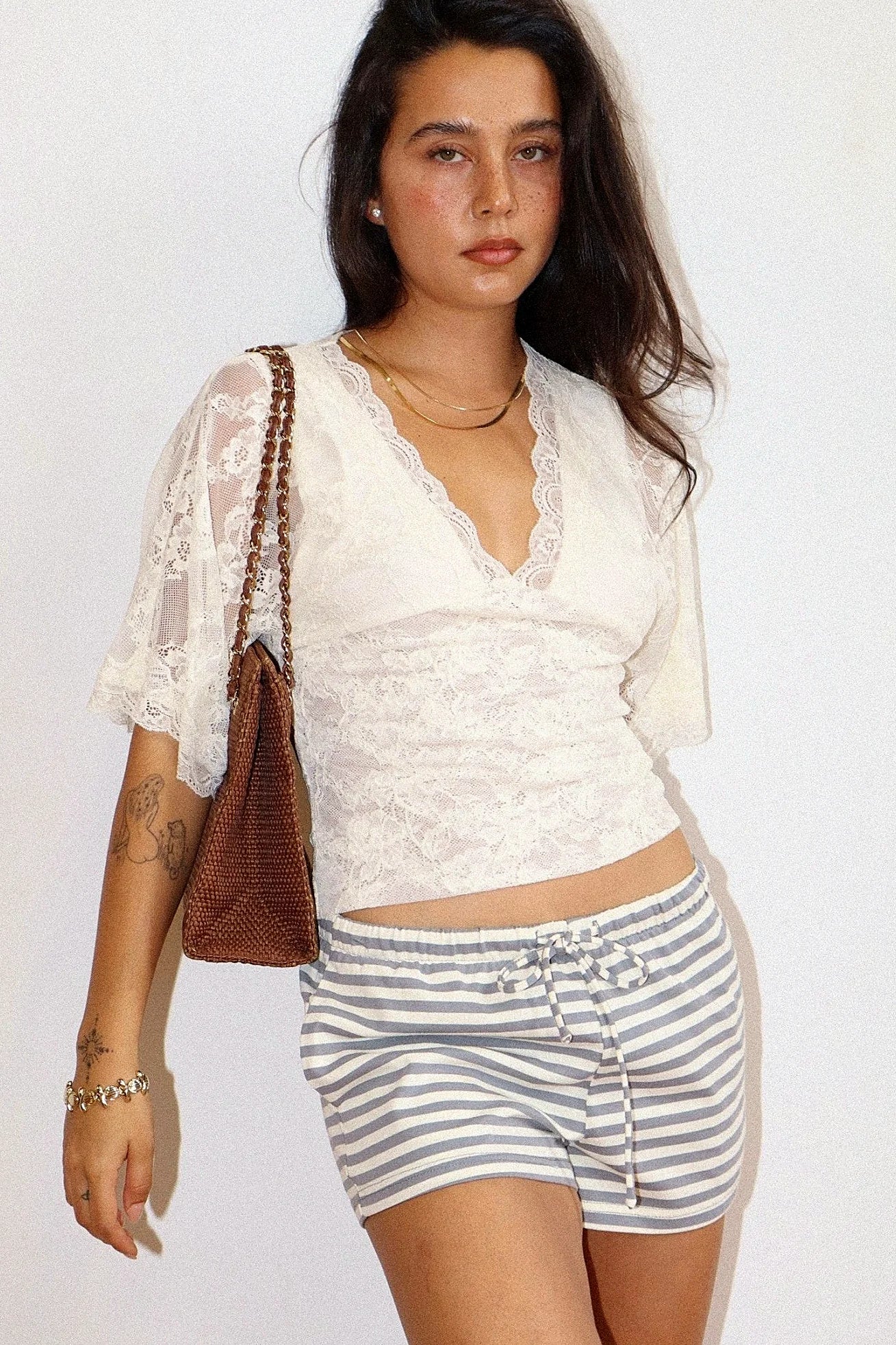 Sheer lace top with a deep scalloped V neckline
