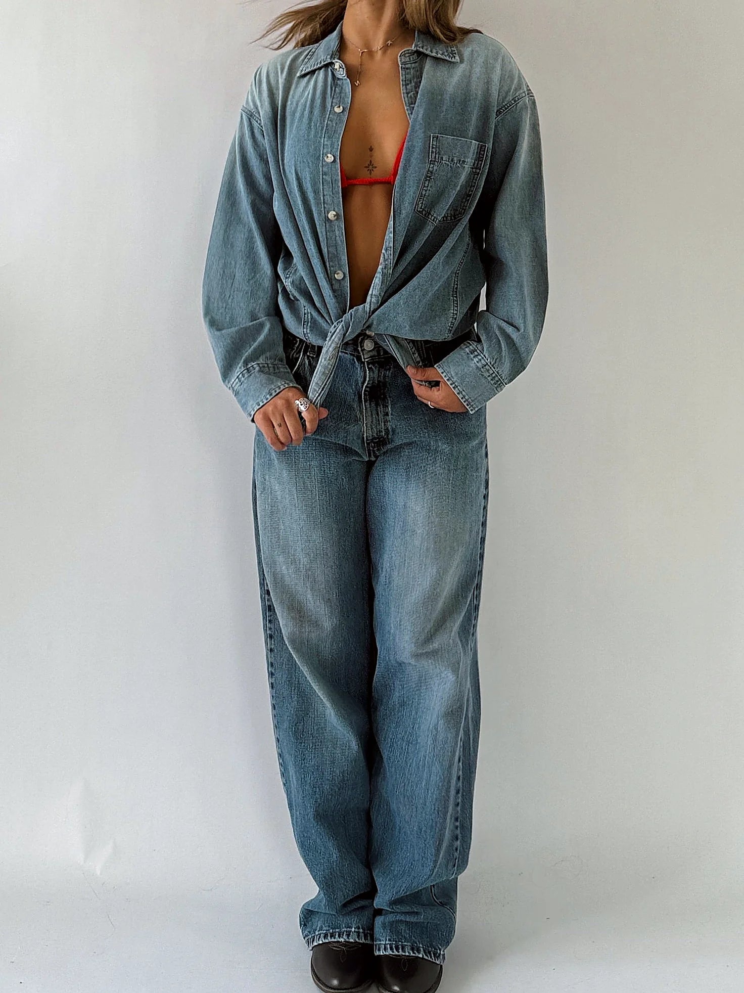 Sleeveless chambray shirt with a full button front