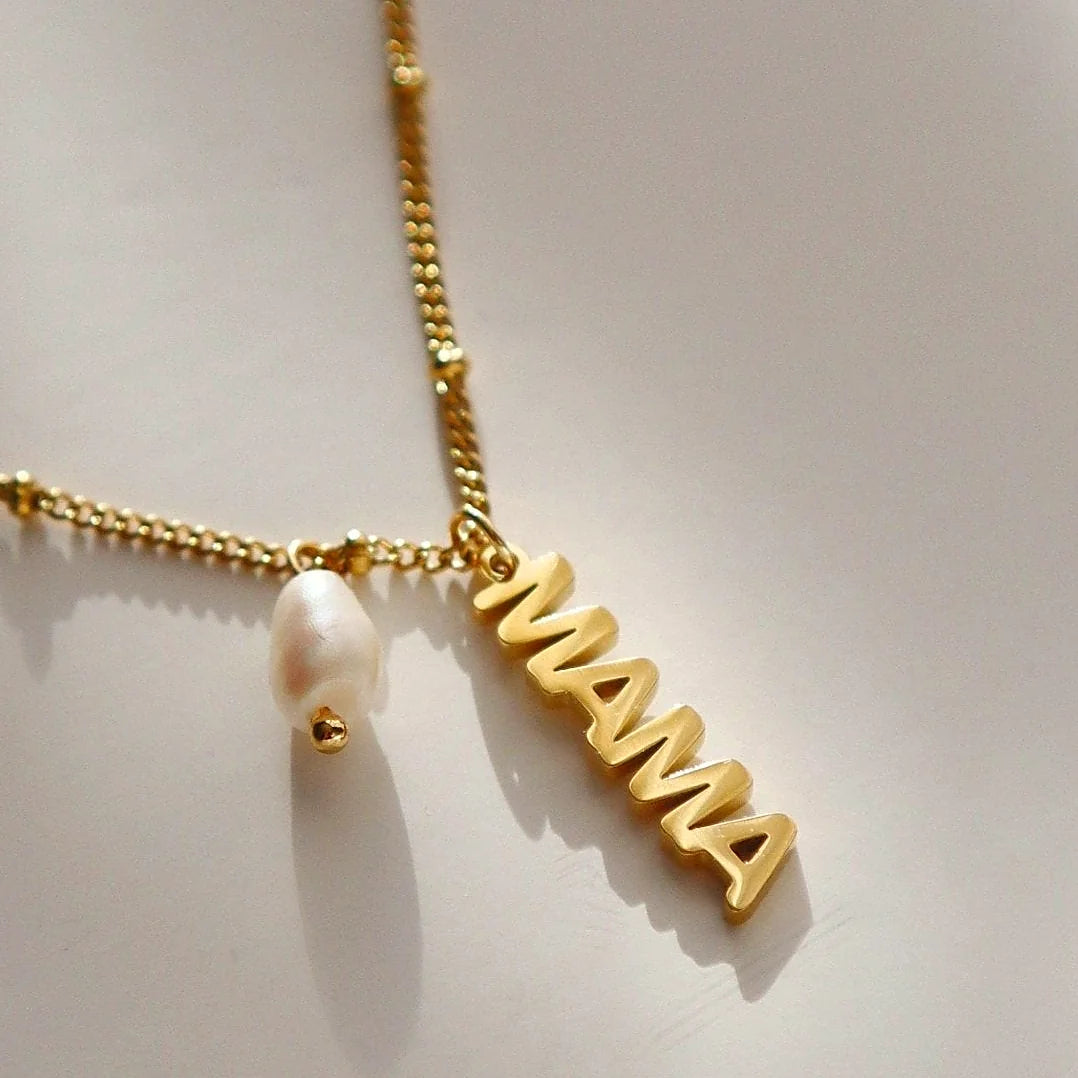 Satellite chain necklace carrying a mama charm and a pearl