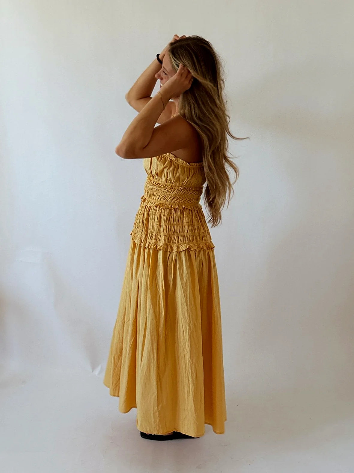 The full length of the tangerine dress