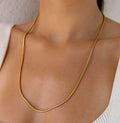 Long gold-plated chain necklace shown at full length