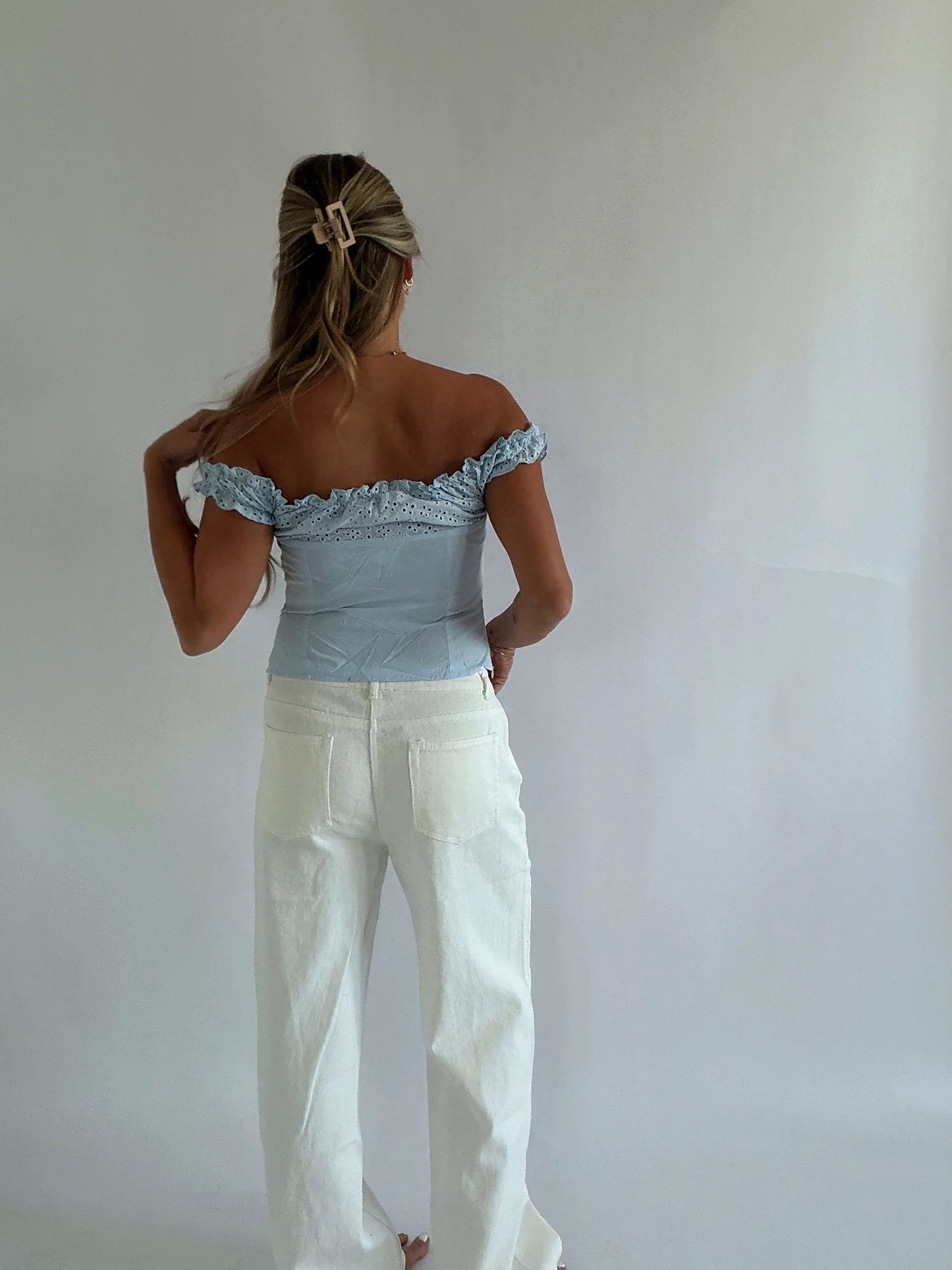 The neckline sitting off the shoulder